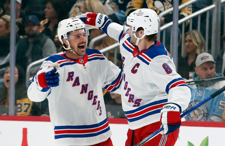 Oct 9, 2024; Pittsburgh, Pennsylvania, USA; New York Rangers center Sam Carrick (39) celebrates his goal with defenseman Jacob Trouba (8) against the Pittsburgh Penguins during the first period at PPG Paints Arena. Mandatory Credit: Charles LeClaire-Imagn Images