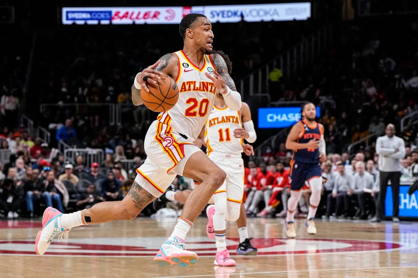 Atlanta Hawks forward John Collins (20) runs towards the basket against the New York Knicks during the second half at State Farm Arena