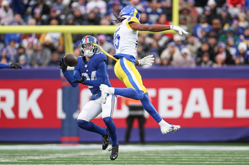 New York Giants safety Dane Belton (24) intercepts a pass intended for Los Angeles Rams wide receiver Demarcus Robinson (15) during the second half at MetLife Stadium