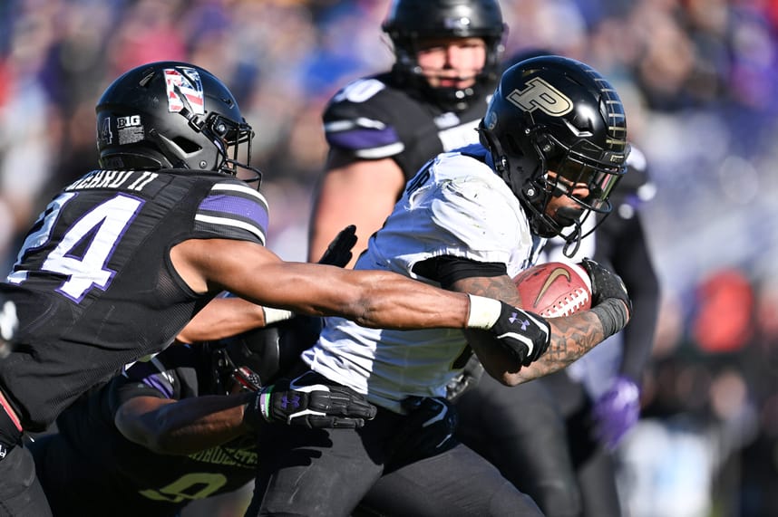 Nov 18, 2023; Evanston, Illinois, USA;  Purdue Boilermakers running back Tyrone Tracy Jr. (3) breaks a tackle by Northwestern Wildcats defensive back Rod Heard II (24) for a touchdown run in the third quarter at Ryan Field. Mandatory Credit: Jamie Sabau-USA TODAY Sports