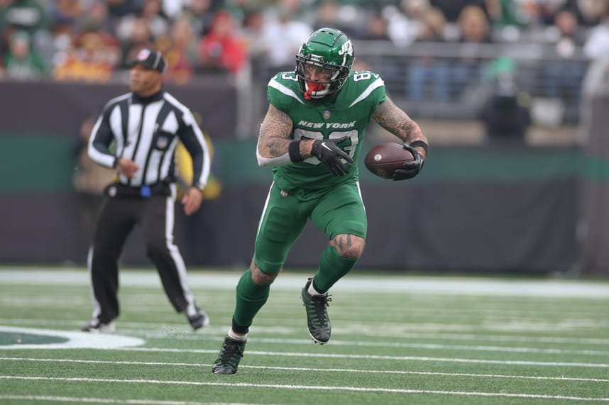New York Jets tight end Tyler Conklin (83) gains yards after a catch during the first half against the Washington Commanders at MetLife Stadium