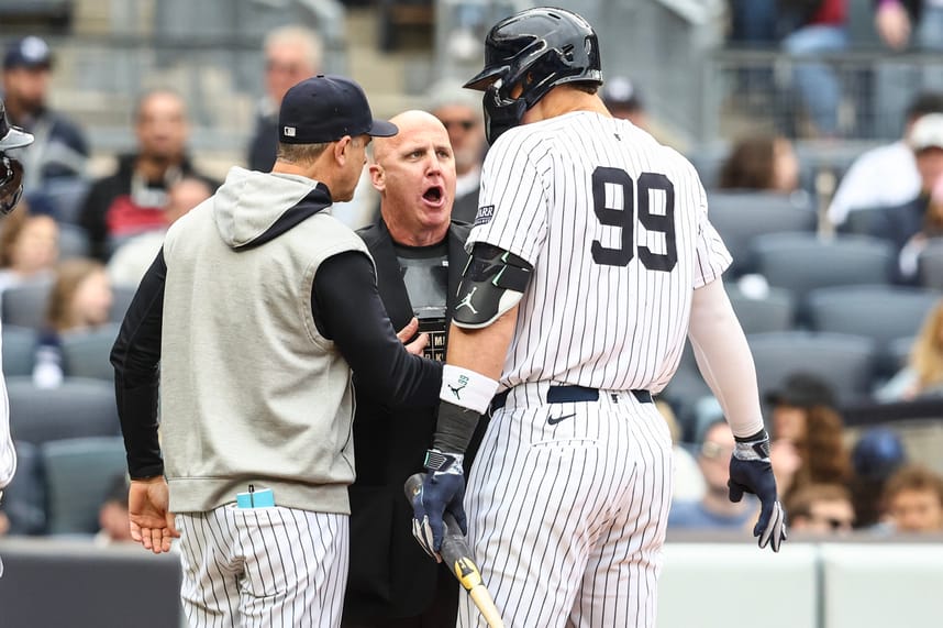 May 4, 2024; Bronx, New York, USA;  New York Yankees center fielder Aaron Judge (99) and manager Aaron Boone (17) argue with home plate umpire Ryan Blakney (36) in the seventh inning against the Detroit Tigers at Yankee Stadium. Mandatory Credit: Wendell Cruz-USA TODAY Sports