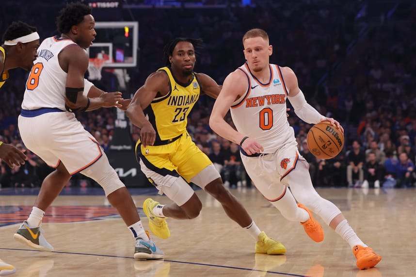 May 6, 2024; New York, New York, USA; New York Knicks guard Donte DiVincenzo (0) handles the ball against Indiana Pacers forward Aaron Nesmith (23) during the first quarter of game one of the second round of the 2024 NBA playoffs at Madison Square Garden. Mandatory Credit: Brad Penner-USA TODAY Sports
