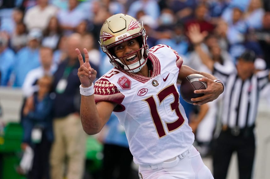 Oct 9, 2021; Chapel Hill, North Carolina, USA; Florida State Seminoles quarterback Jordan Travis (13) runs for a touchdown against the North Carolina Tar Heels during the first half at Kenan Memorial Stadium. Mandatory Credit: James Guillory-USA TODAY Sports