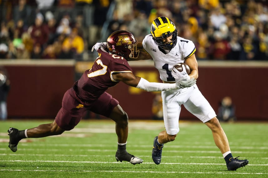 Oct 7, 2023; Minneapolis, Minnesota, USA; Michigan Wolverines wide receiver Roman Wilson (1) runs while Minnesota Golden Gophers defensive back Tyler Nubin (27)(New York Giants) defends during the third quarter at Huntington Bank Stadium. Mandatory Credit: Matt Krohn-USA TODAY Sports