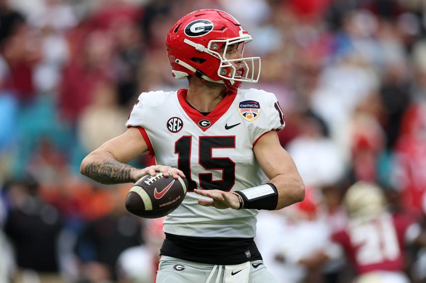 Dec 30, 2023; Miami Gardens, FL, USA; Georgia Bulldogs quarterback Carson Beck (New York Giants prospect) (15) drops back to pass against the Florida State Seminoles during the first half in the 2023 Orange Bowl at Hard Rock Stadium. Mandatory Credit: Nathan Ray Seebeck-USA TODAY Sports