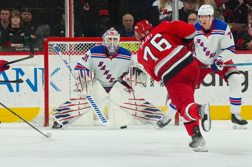 Mar 23, 2023; Raleigh, North Carolina, USA;  Carolina Hurricanes defenseman Brady Skjei (76) takes a shot at New York Rangers goaltender Igor Shesterkin (31) during the second period at PNC Arena. Mandatory Credit: James Guillory-USA TODAY Sports