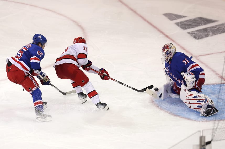 May 7, 2024; New York, New York, USA; Carolina Hurricanes center Sebastian Aho (20) takes a shot against New York Rangers goaltender Igor Shesterkin (31) in front of Rangers defenseman Ryan Lindgren (55) during the first overtime of game two of the second round of the 2024 Stanley Cup Playoffs at Madison Square Garden. Mandatory Credit: Brad Penner-USA TODAY Sports