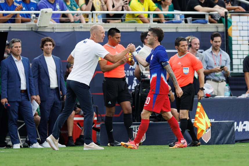 Jun 12, 2024; Orlando, Florida, USA; United States midfielder Christian Pulisic (10) celebrates with head coach Gregg Berhalter after scoring a goal against Brazil in the first half during the Continental Clasico at Camping World Stadium. Mandatory Credit: Nathan Ray Seebeck-USA TODAY Sports
