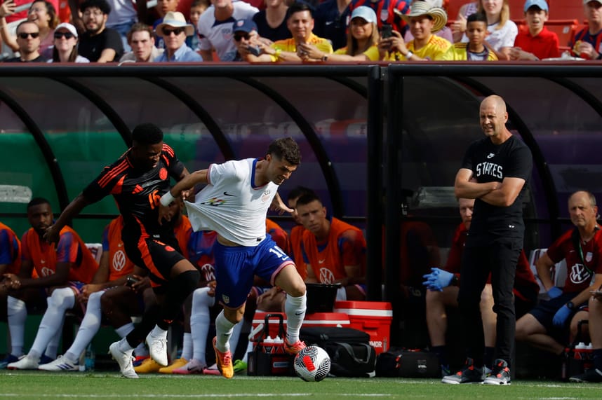Jun 8, 2024; Landover, Maryland, USA; United States forward Christian Pulisic (10) dribbles the ball while being grabbed by Colombia midfielder Jefferson Lerma (16) in the first half at Commanders Field. Mandatory Credit: Geoff Burke-USA TODAY Sports
