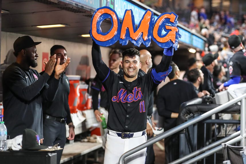 Jul 12, 2024; New York City, New York, USA;  New York Mets second baseman Jose Iglesias (11) celebrates in the dugout after hitting a solo home run in the fifth inning against the Colorado Rockies at Citi Field. Mandatory Credit: Wendell Cruz-USA TODAY Sports