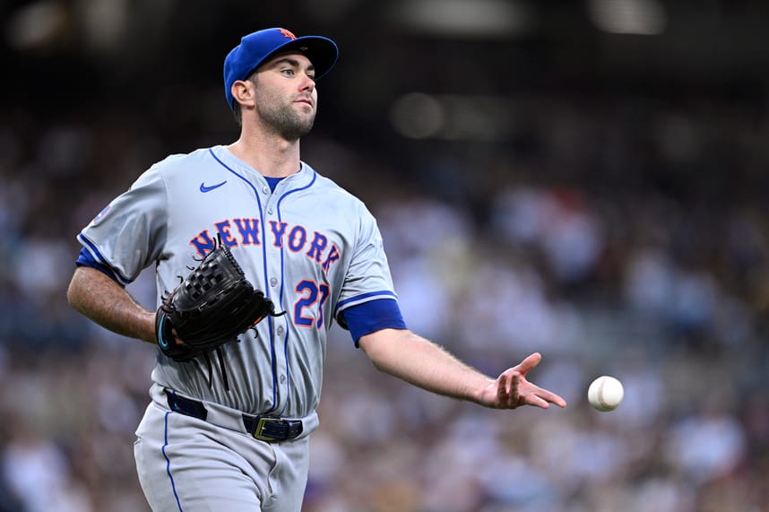 Aug 24, 2024; San Diego, California, USA; New York Mets starting pitcher David Peterson (23) tosses the ball to first base during the fifth inning against the San Diego Padres at Petco Park. Mandatory Credit: Orlando Ramirez-USA TODAY Sports