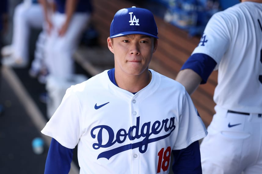 Sep 22, 2024; Los Angeles, California, USA;  Los Angeles Dodgers starting pitcher Yoshinobu Yamamoto (18) walks in the dugout during the third inning against the Colorado Rockies at Dodger Stadium. Mandatory Credit: Kiyoshi Mio-Imagn Images