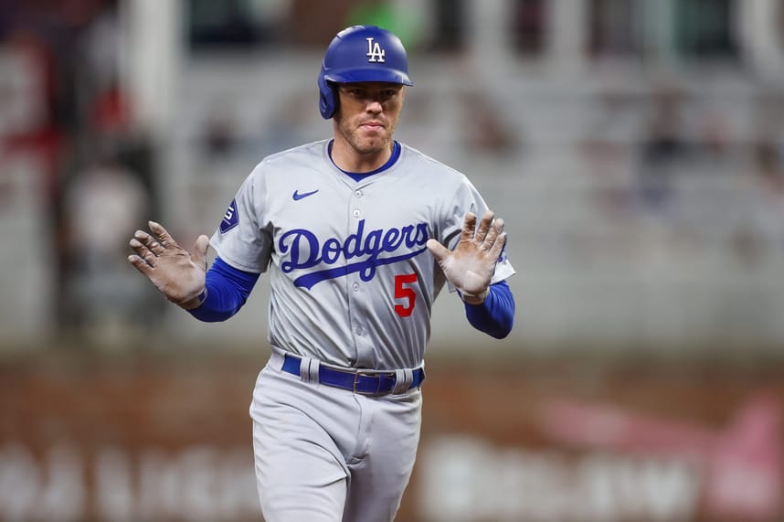 Sep 16, 2024; Atlanta, Georgia, USA; Los Angeles Dodgers first baseman Freddie Freeman (5) celebrates after a three-run home run against the Atlanta Braves in the seventh inning at Truist Park. Mandatory Credit: Brett Davis-Imagn Images
