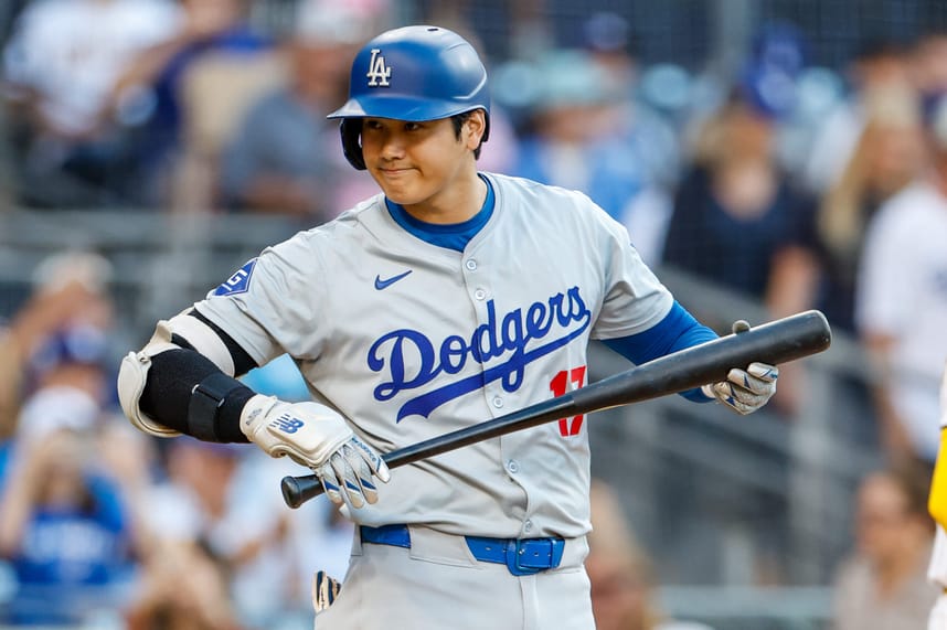 Jul 30, 2024; San Diego, California, USA; Los Angeles Dodgers designated hitter Shohei Ohtani (17) looks into the San Diego Padres dugout before his at bat during the first inning at Petco Park. Mandatory Credit: David Frerker-Imagn Images