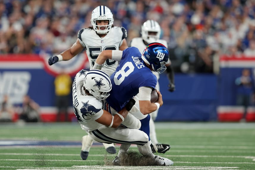 Sep 26, 2024; East Rutherford, New Jersey, USA; Dallas Cowboys defensive end Marshawn Kneeland (94) sacks New York Giants quarterback Daniel Jones (8) during the third quarter at MetLife Stadium. Mandatory Credit: Brad Penner-Imagn Images