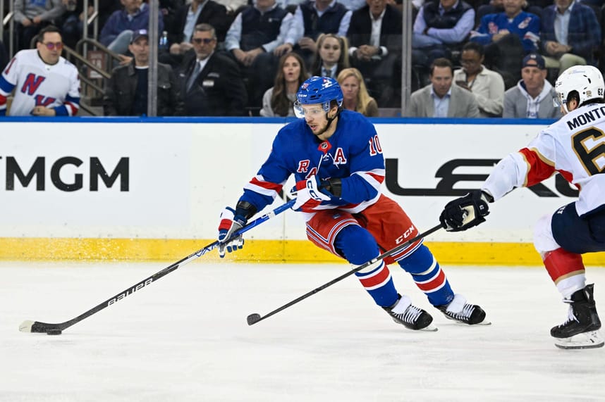 May 30, 2024; New York, New York, USA; New York Rangers left wing Artemi Panarin (10) skates with the puck as Florida Panthers defenseman Brandon Montour (62) defends during the third period in game five of the Eastern Conference Final of the 2024 Stanley Cup Playoffs at Madison Square Garden. Mandatory Credit: Dennis Schneidler-Imagn Images