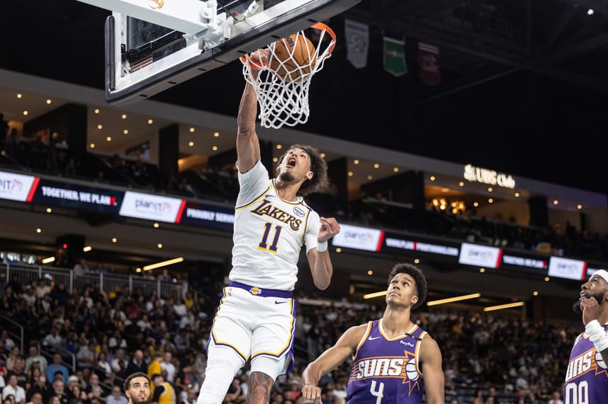 Oct 6, 2024; Palm Desert, California, USA; Los Angeles Lakers center Jaxson Hayes (11) dunks over Phoenix Suns center Oso Ighodaro (4) during the second half at Acrisure Arena. Mandatory Credit: David Frerker-Imagn Images