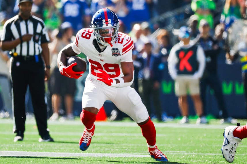 Oct 6, 2024; Seattle, Washington, USA; New York Giants running back Tyrone Tracy Jr. (29) rushes against the Seattle Seahawks during the first quarter at Lumen Field. Mandatory Credit: Joe Nicholson-Imagn Images
