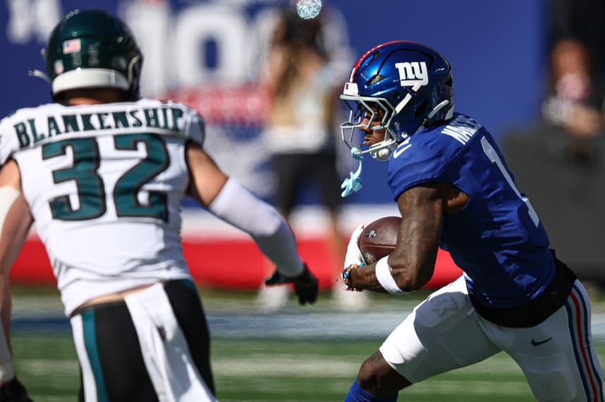 Oct 20, 2024; East Rutherford, New Jersey, USA; New York Giants wide receiver Malik Nabers (1) gains yards after catch as Philadelphia Eagles safety Reed Blankenship (32) pursues during the first half at MetLife Stadium. Mandatory Credit: Vincent Carchietta-Imagn Images