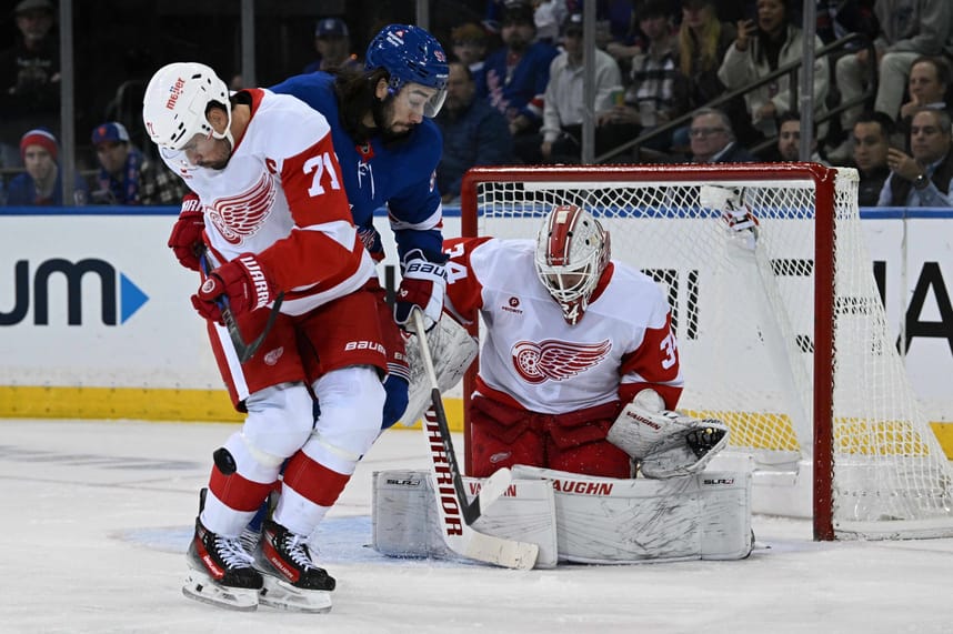 Oct 14, 2024; New York, New York, USA;  Detroit Red Wings center Dylan Larkin (71) blocks a shot in front of New York Rangers center Mika Zibanejad (93) and Detroit Red Wings goaltender Alex Lyon (34) during the first period at Madison Square Garden. Mandatory Credit: Dennis Schneidler-Imagn Images