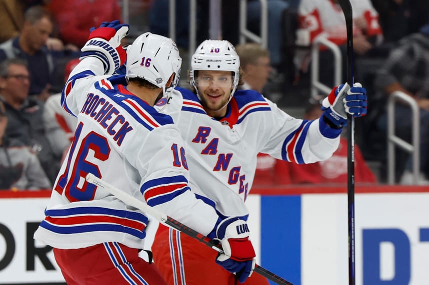 Oct 17, 2024; Detroit, Michigan, USA; New York Rangers left wing Artemi Panarin (10) receives congratulations from teammates after scoring in the first period against the Detroit Red Wings at Little Caesars Arena. Mandatory Credit: Rick Osentoski-Imagn Images