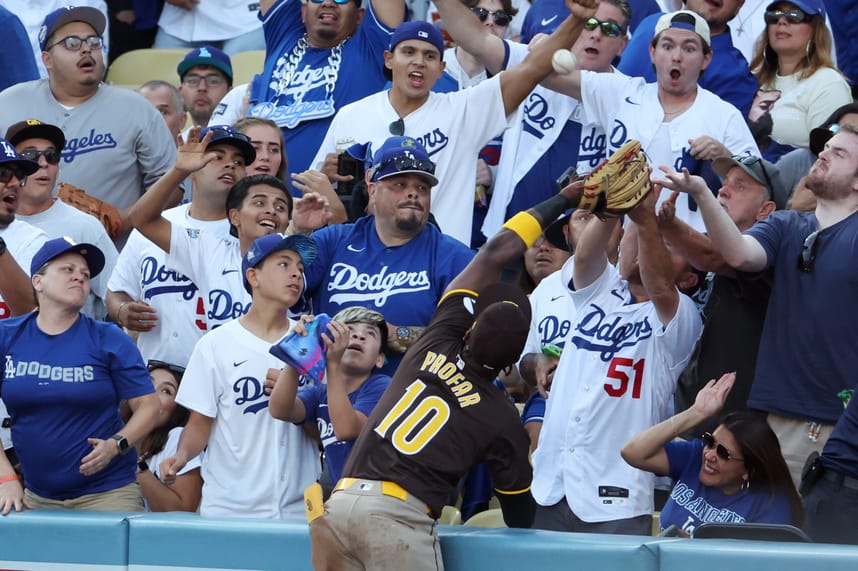 Oct 6, 2024; Los Angeles, California, USA; San Diego Padres outfielder Jurickson Profar (10) catches a ball hit by Los Angeles Dodgers shortstop Mookie Betts (50) in the first inning during game two of the NLDS for the 2024 MLB Playoffs at Dodger Stadium. Mandatory Credit: Kiyoshi Mio-Imagn Images
