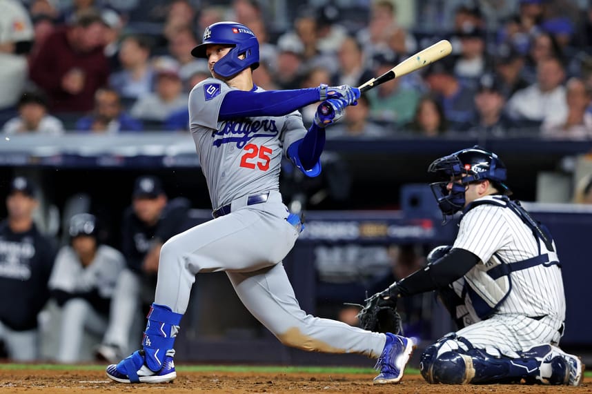 Oct 30, 2024; New York, New York, USA; Los Angeles Dodgers outfielder Tommy Edman (25) breaks his bat while hitting a single during the eighth inning against the New York Yankees in game four of the 2024 MLB World Series at Yankee Stadium. Mandatory Credit: Brad Penner-Imagn Images