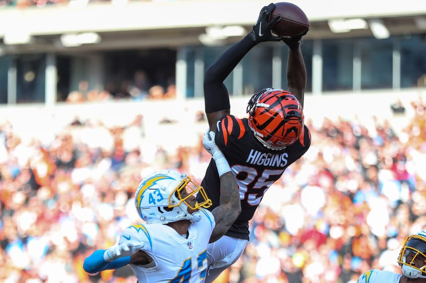 Dec 5, 2021; Cincinnati, Ohio, USA; Cincinnati Bengals wide receiver Tee Higgins (85) catches a pass in the end zone against Los Angeles Chargers cornerback Michael Davis (43) in the first half at Paul Brown Stadium. Mandatory Credit: Katie Stratman-Imagn Images
