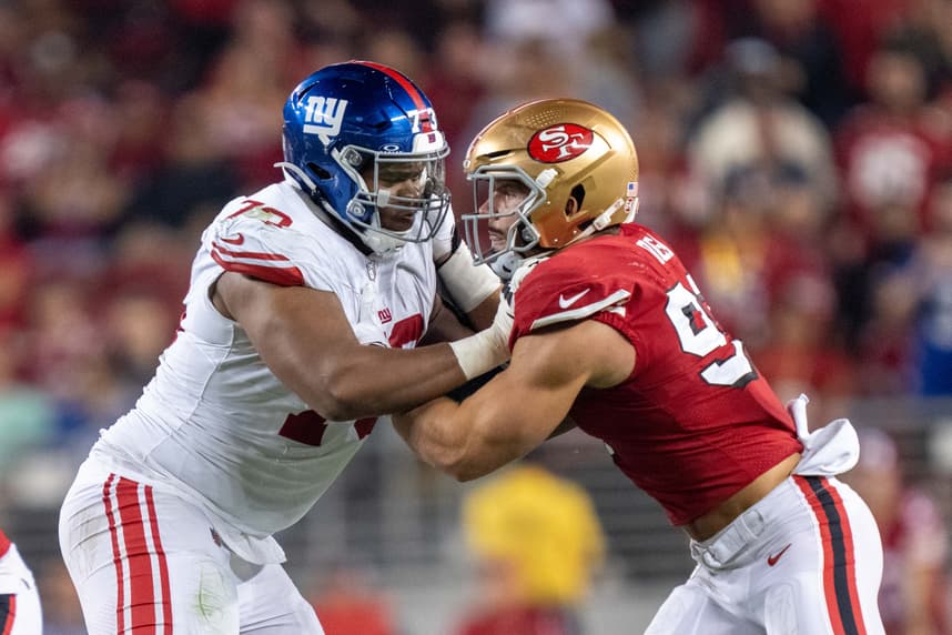 Evan Neal blocks Nick Bosa during a Giants game against San Francisco