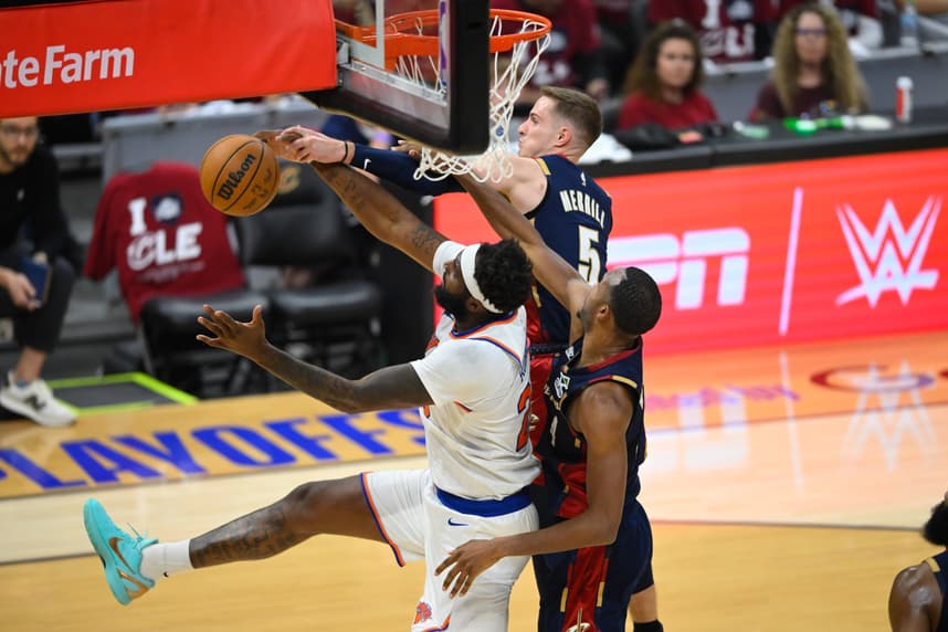 Mitchell Robinson reaches for a rebound for the Knicks against the Cavaliers