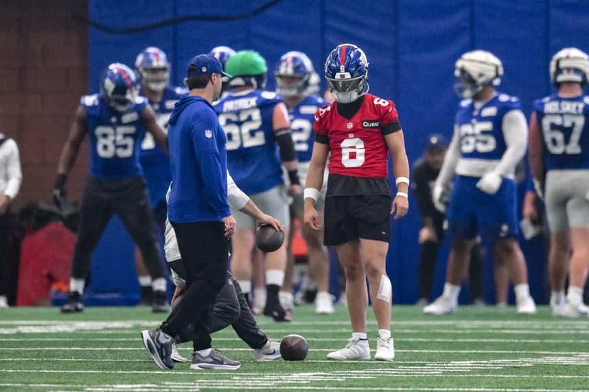 Jaxson Dart participates in a drill during Giants OTAs