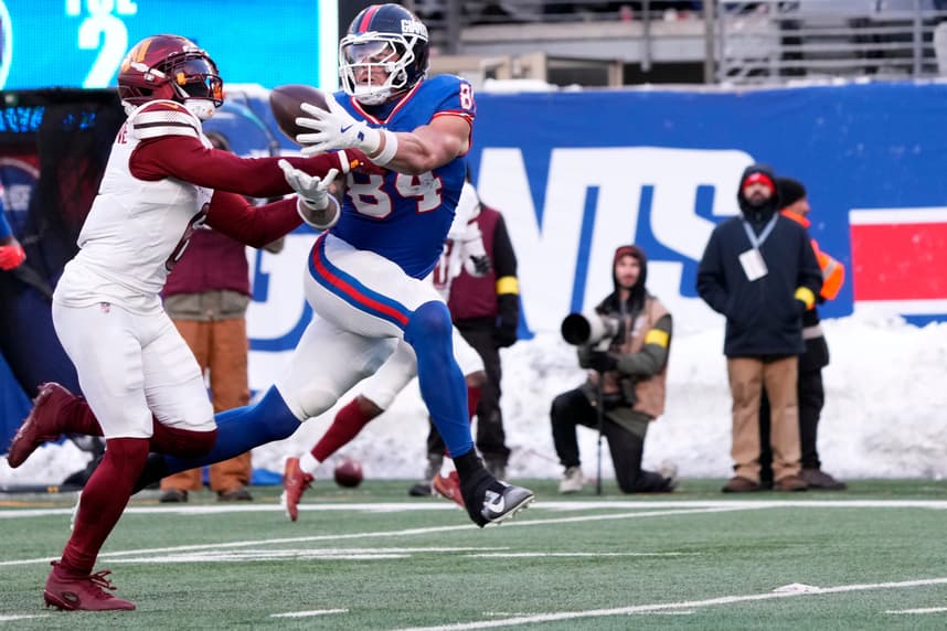 Theo Johnson, New York Giants tight end Theo Johnson (84) catches a ball by Washington Commanders cornerback Noah Igbinoghene (6), Sunday,