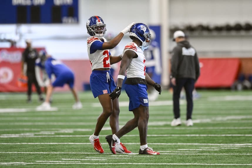 Deonte Banks works with Paulson Adebo during Giants organized team activities