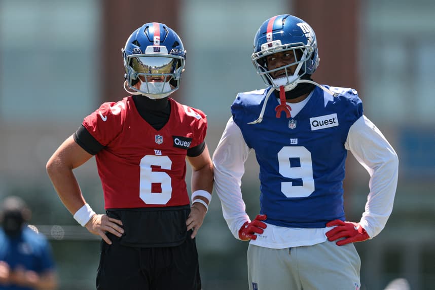 Jaxson Dart and Isaiah Likely talk during Giants organized team activities