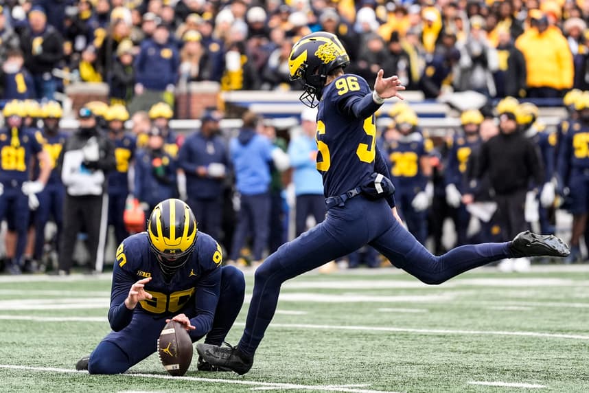 Dominic Zvada attempts a field goal for Michigan