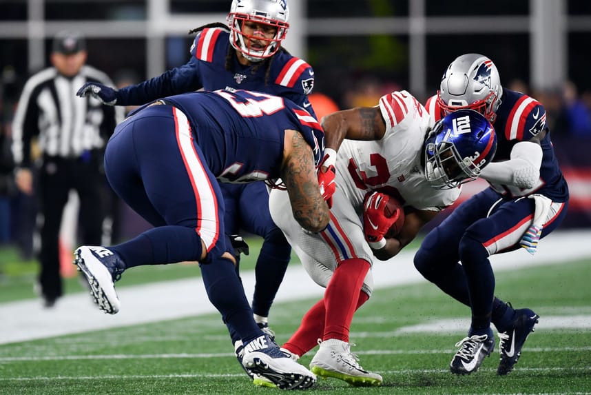 Oct 10, 2019; Foxborough, MA, USA; New England Patriots free safety Devin McCourty (32) and defensive tackle Lawrence Guy (93) tackle New York Giants running back Elijhaa Penny (39) during the second half at Gillette Stadium. Mandatory Credit: Bob DeChiara-USA TODAY Sports