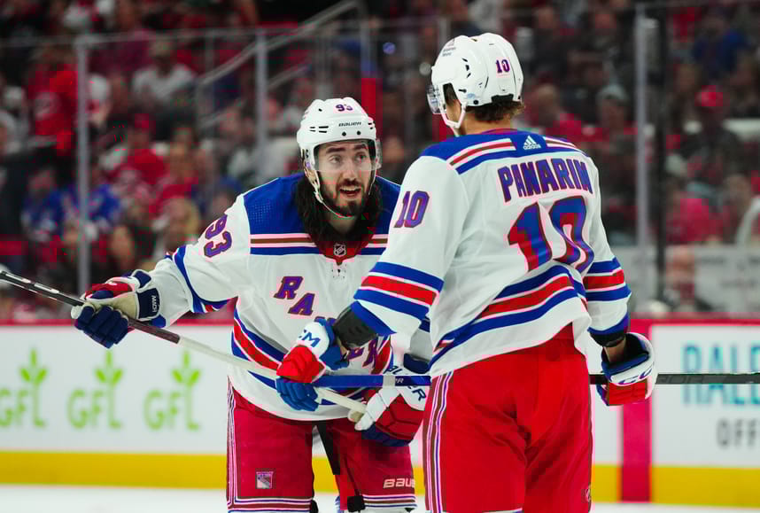 May 9, 2024; Raleigh, North Carolina, USA; New York Rangers center Mika Zibanejad (93) and left wing Artemi Panarin (10) talks against the Carolina Hurricanes during the second period in game three of the second round of the 2024 Stanley Cup Playoffs at PNC Arena. Mandatory Credit: James Guillory-USA TODAY Sports