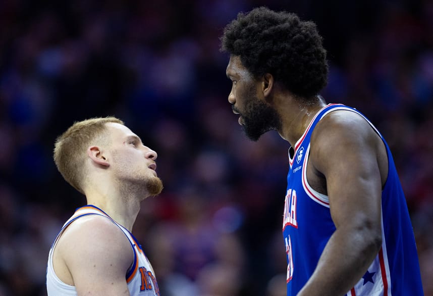 Apr 25, 2024; Philadelphia, Pennsylvania, USA; Philadelphia 76ers center Joel Embiid (21) has words with New York Knicks guard Donte DiVincenzo (L) after a play during the first quarter of game three of the first round for the 2024 NBA playoffs at Wells Fargo Center. Mandatory Credit: Bill Streicher-USA TODAY Sports
