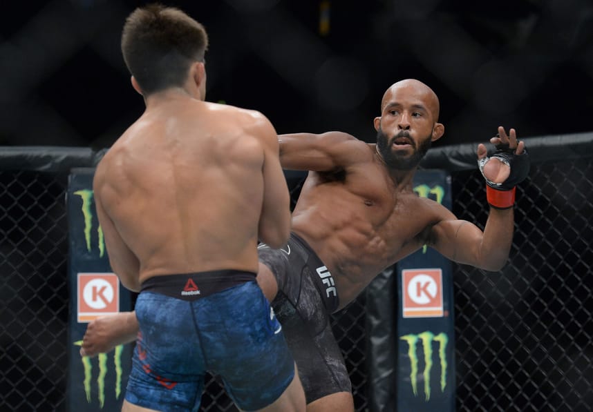 August 4, 2018; Los Angeles, CA, USA; Demetrious Johnson moves in against Henry Cejudo during UFC 227 at Staples Center. Mandatory Credit: Gary A. Vasquez-Imagn Images