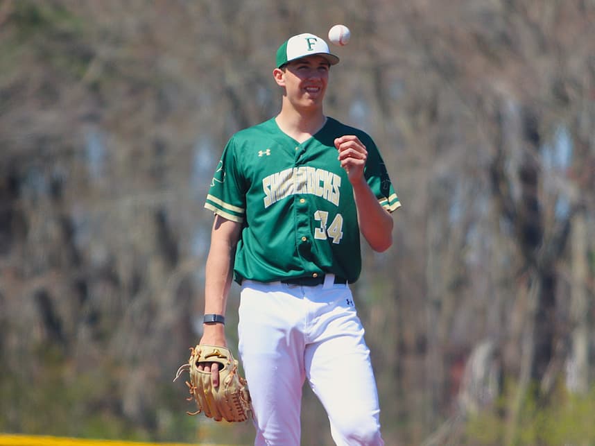 Bishop Feehan's Brody Bumila, a Raynham resident, tosses up the ball during a non-league game against Taunton on April 23, 2026.