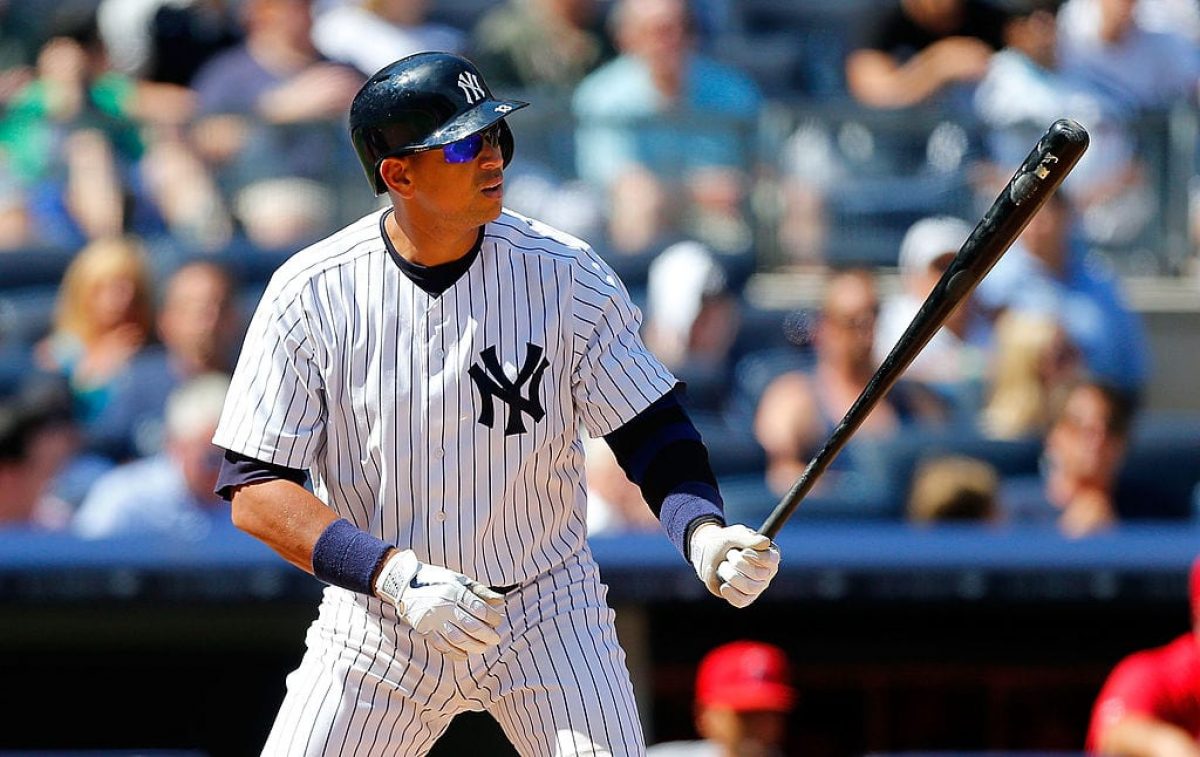 Scott Brosius of the New York Yankees celebrates hitting a home run