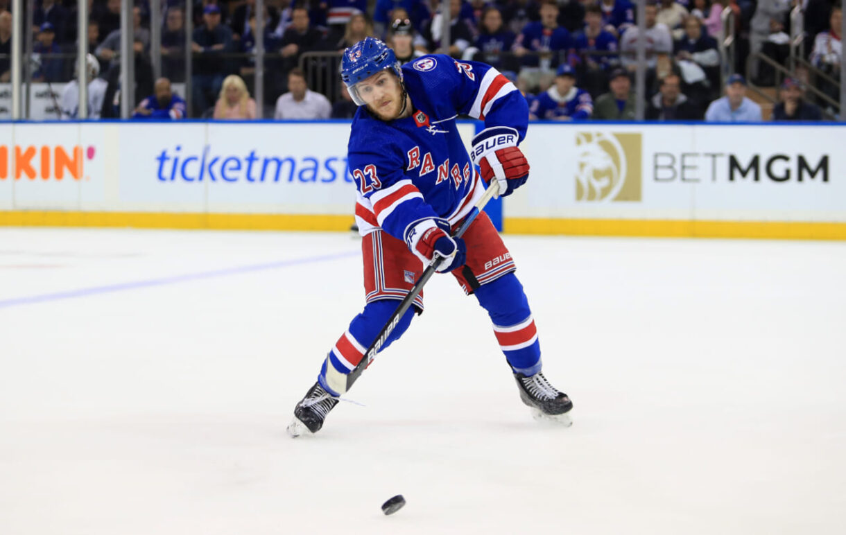 New York Rangers defenseman Adam Fox (23) passes the puck against the Tampa Bay Lightning in the first period of game one of the Eastern Conference Final of the 2022 Stanley Cup Playoffs at Madison Square Garden