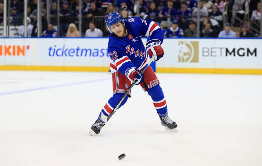 New York Rangers defenseman Adam Fox (23) passes the puck against the Tampa Bay Lightning in the first period of game one of the Eastern Conference Final of the 2022 Stanley Cup Playoffs at Madison Square Garden