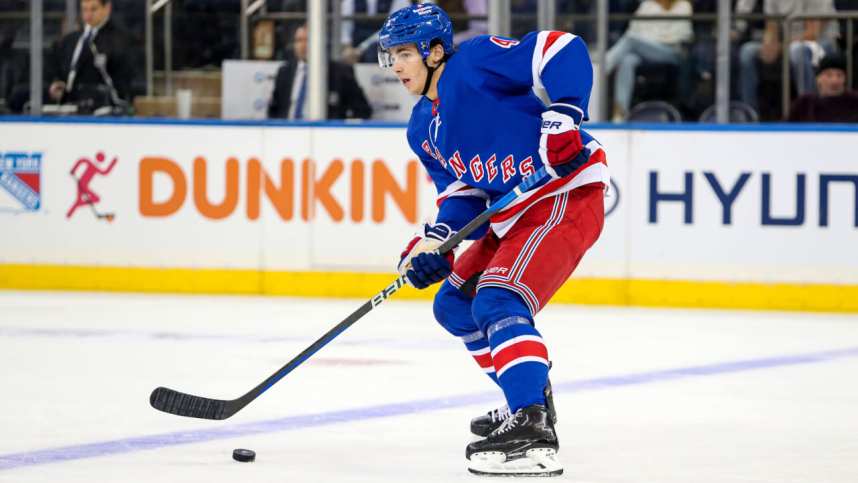 New York Rangers defenseman Braden Schneider (4) plays the puck against the San Jose Sharks during the second period at Madison Square Garden.