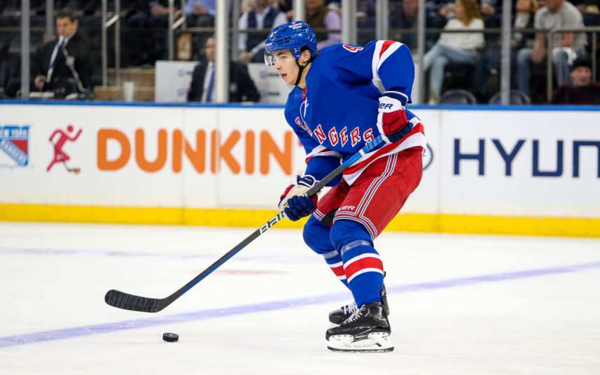 New York Rangers defenseman Braden Schneider (4) plays the puck against the San Jose Sharks during the second period at Madison Square Garden.
