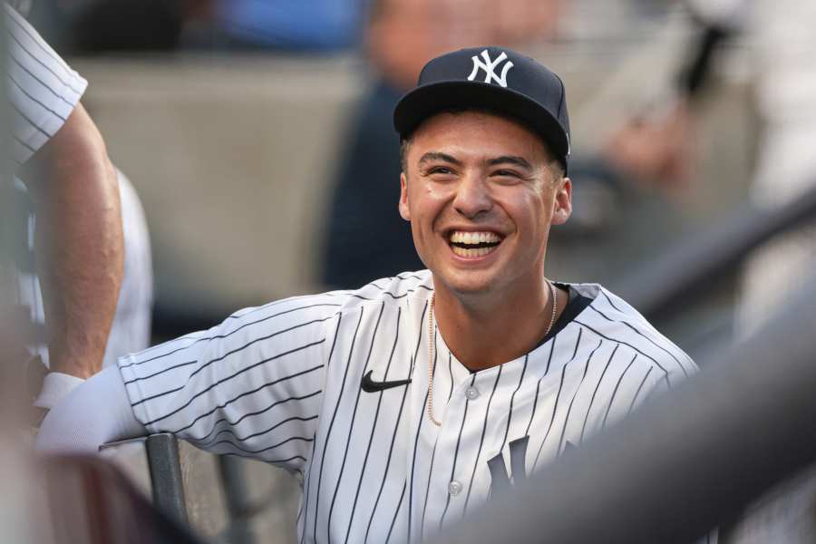 CLEVELAND, OH - APRIL 12: New York Yankees shortstop Anthony Volpe (11)  makes the catch for an out during the eighth inning of the the Major League  Baseball game between the New