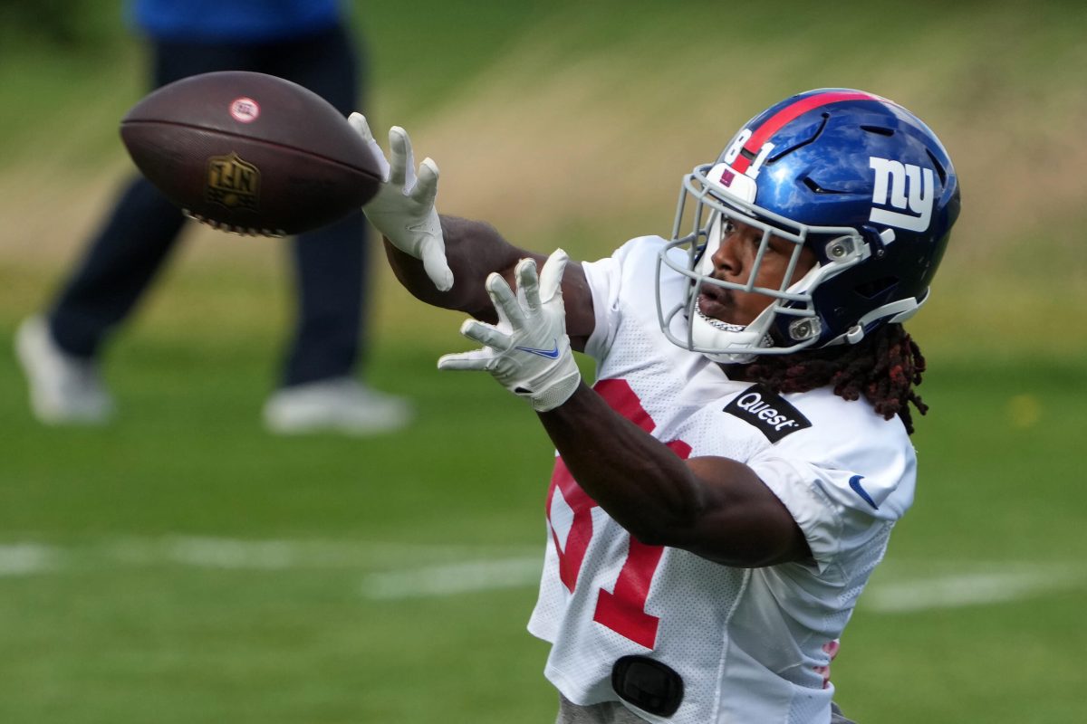 New York Giants wide receiver Collin Johnson (15) throws a shirt to fans  after the NFL football team's practice in East Rutherford, N.J., Friday,  Aug. 5, 2022. (AP Photo/Adam Hunger Stock Photo - Alamy