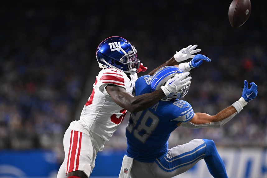 New York Giants cornerback Deonte Banks (36) breaks up a pass intended for Detroit Lions wide receiver Chase Cota (88) in the first quarter at Ford Field