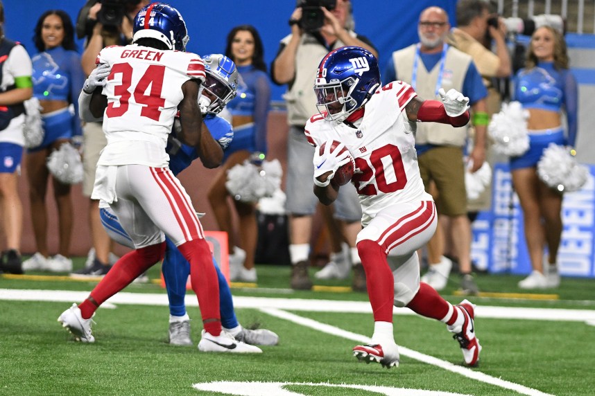 New York Giants running back Eric Gray (20) returns a punt against the Detroit Lions in the second quarter at Ford Field
